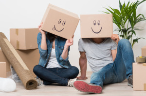 Couple having fun while moving home